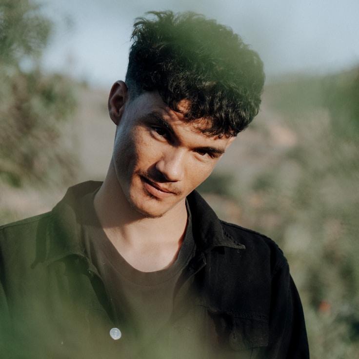 Portrait of Liam Chen, group coordinator and fusion cooking expert